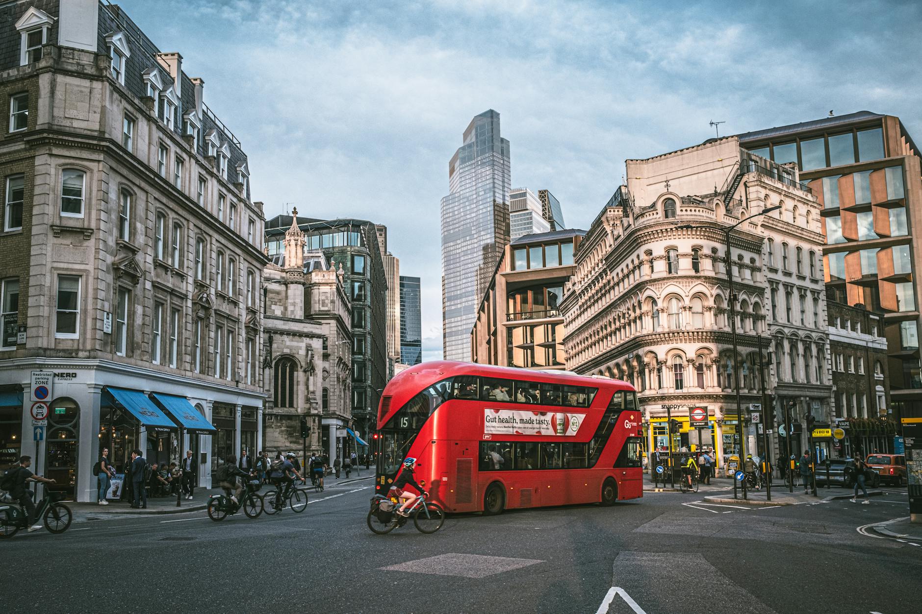 red double decker bus on street in london