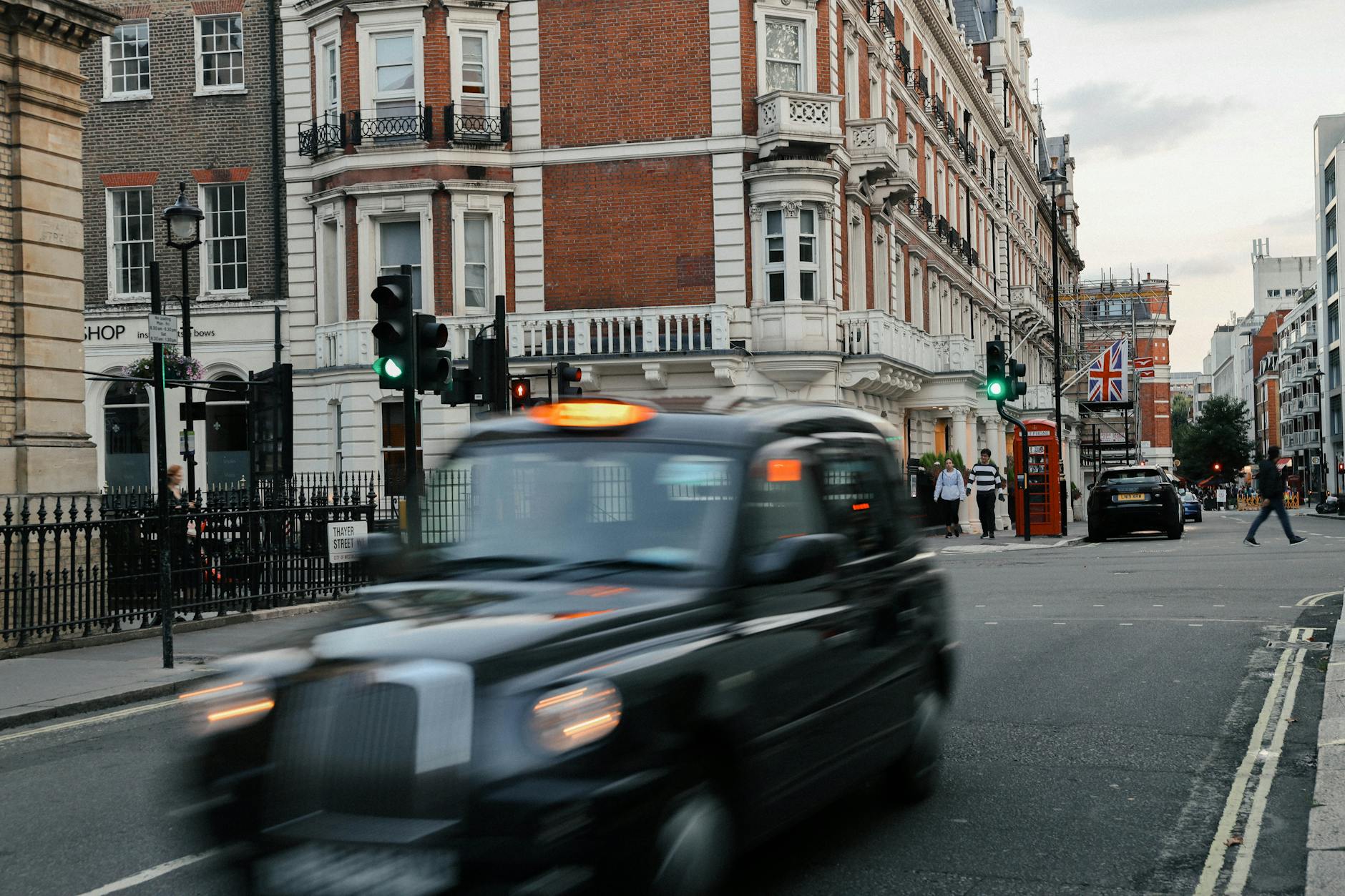 cars on road near buildings
