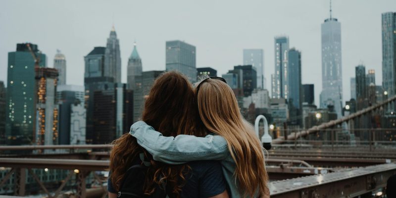a couple enjoying the view of the new york city skyline